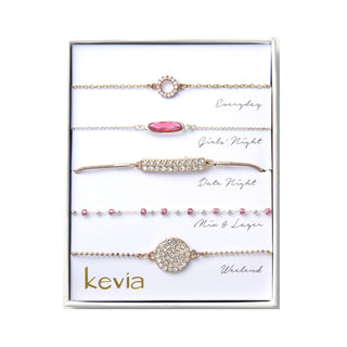 five-piece bracelet set with pavé charms and faceted beads in blush pink and sparkling cubic zirconia, packaged in a gift box