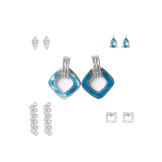 Five-piece silver earring set featuring blue enamel geometric drop earrings with silver cuff accents, crystal diamond drops, minimalist silver studs, and pavé accents, packaged in a gift box.