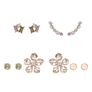 Five-pair gold earring set featuring hammered gold floral studs, green gemstones, crystal ear climbers, and minimalist gold accents, packaged in a gift box.