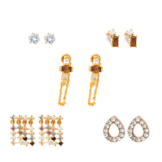 Five-piece gold earring set with champagne and citrine accents, including fringe designs, crystal pavé teardrop studs, geometric bar earrings, and chain-accented drops, packaged in a gift box.
