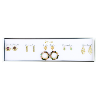 Five-pair gold earring set with multi-color gemstone hoops, gold leaf drops, pink crystal posts, pavé bars, and green teardrop studs packaged in a gift box.
Ask ChatGPT