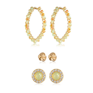 Three-pair gold-tone earring set featuring opalescent beaded hoops, twisted knot studs, and green gemstone halo crystal studs.