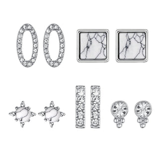 Five-pair silver-tone earring set featuring oval crystal hoops, marble square studs, starburst marble studs, crystal bar studs, and round crystal earrings.