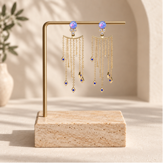 Gold chain fringe earrings with opal studs and small opal accents on cascading chains.