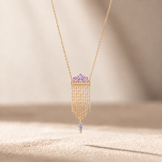 Gold necklace with opal accents, chain fringe and a single opal drop pendant.