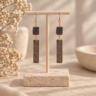 Long dark patina rectangular drop earrings with geometric engraving and dark textured stone tops.
