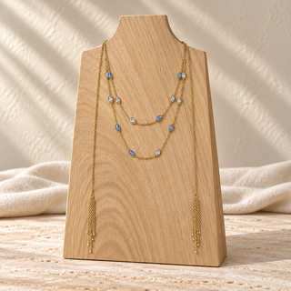 Gold layered lariat necklace with blue opal accents and two long chain tassels.