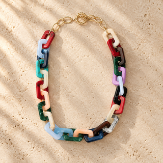 Chunky necklace with multicolored rectangular resin links and a gold chain clasp.