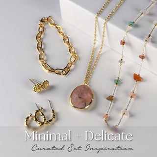 Minimal and Delicate five-piece mystery jewelry set with a soft pink stone pendant, gold chain bracelet, dainty gemstone beaded necklace, floral stud earrings, and twisted gold hoops. Packaged as a curated set inspiration.