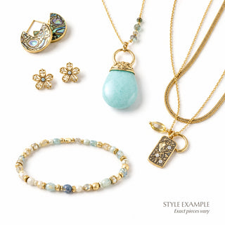 Style example image for The Bohemian + Artistic Curated Jewelry Bundle featuring turquoise, gold, and mixed-material jewelry, including necklaces, earrings, and a beaded bracelet.