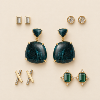 Five pairs of gold earrings with deep green double-stone drops, green crystal clusters, clear rectangles, crossed bars, and pavé discs on cream.
