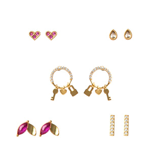 Five-pair gold earring set featuring pavé pink heart stud earrings, clear teardrop crystal stud earrings with gold beaded edges, small pavé hoop earrings with dangling heart, lock, and key charms, marquise-cut pink crystal stud earrings with gold accent details, and slim pavé bar stud earrings, packaged in a gift box.