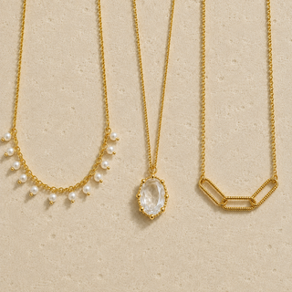 Crystal Glow layered gold necklace set with pearls and crystal pendant