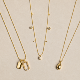 Gold Teardrop and Pavé Charm necklace set styled product image