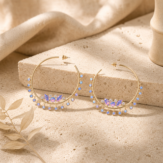 Gold hoop earrings with iridescent opal clusters and dangling round opal charms.
