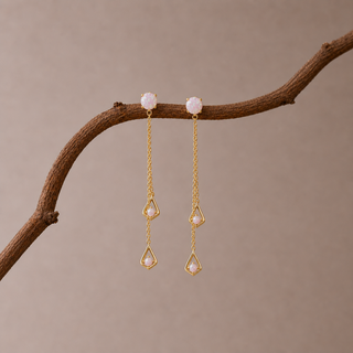 Gold double chain drop earrings with opal studs and teardrop opal pendants.
