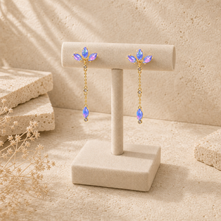 Gold chain drop earrings with marquise opal clusters and single opal pendants.