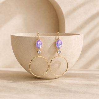 Gold hoop drop earrings with oval iridescent opals and round crystal accents.