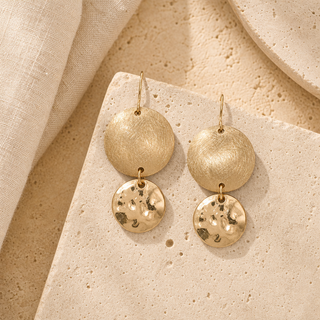 Gold double circle drop earrings with textured upper discs and hammered lower discs.