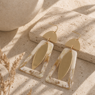 gold and natural horn drop earrings with semicircle tops, open horn frames and long marquise pendants.